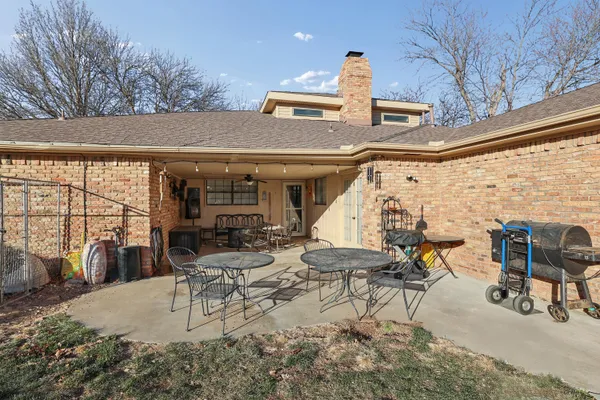 a view of living room kitchen with furniture and floor to ceiling window
