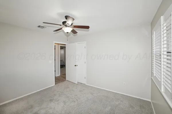 a view of a chandelier fan in a room