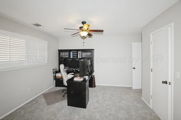 a view of a workspace with furniture