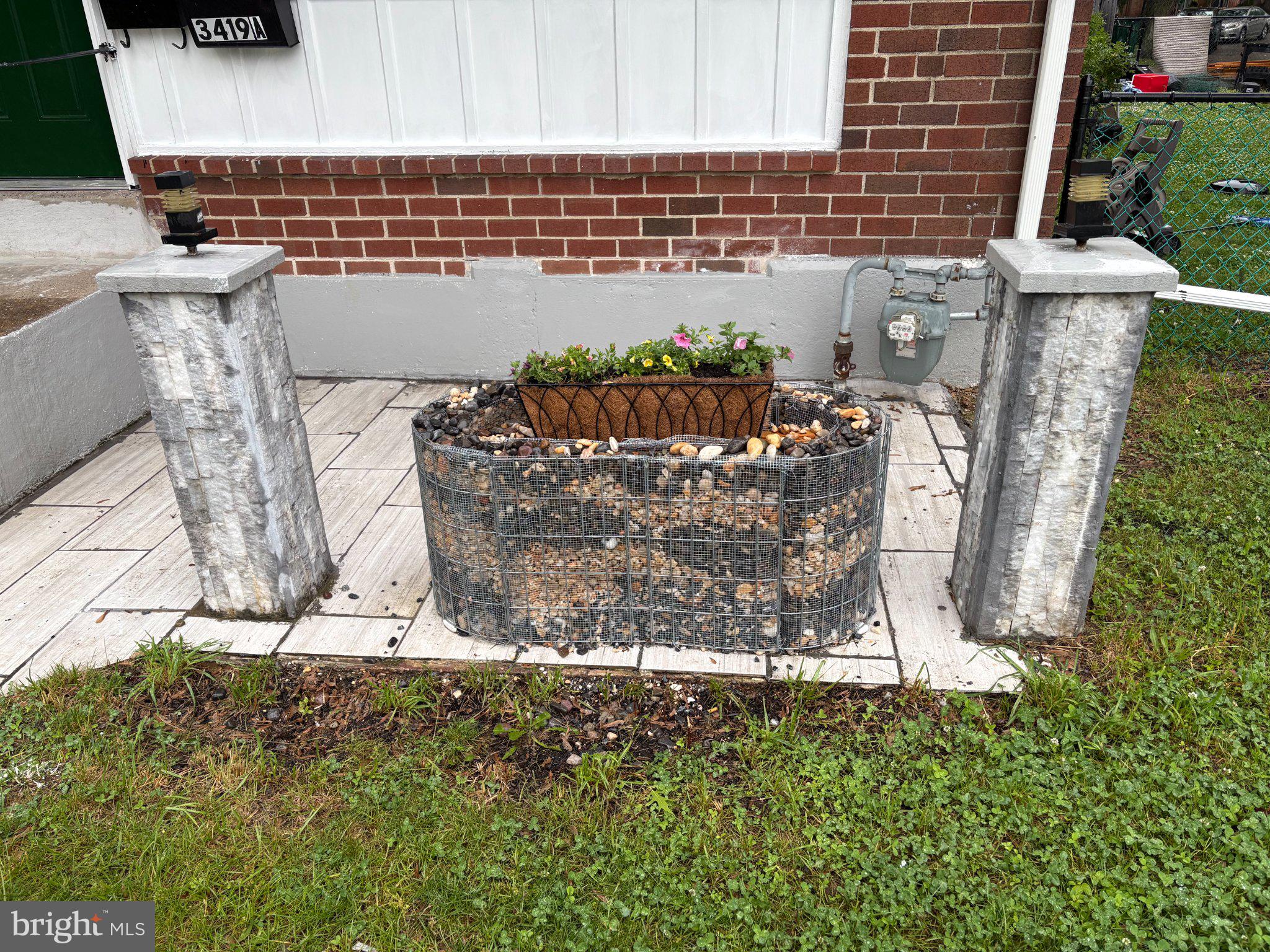 3419 Carter Lane Chester, PA 19013 - Photo 2 of 52 Charming garden feature with stone accents.