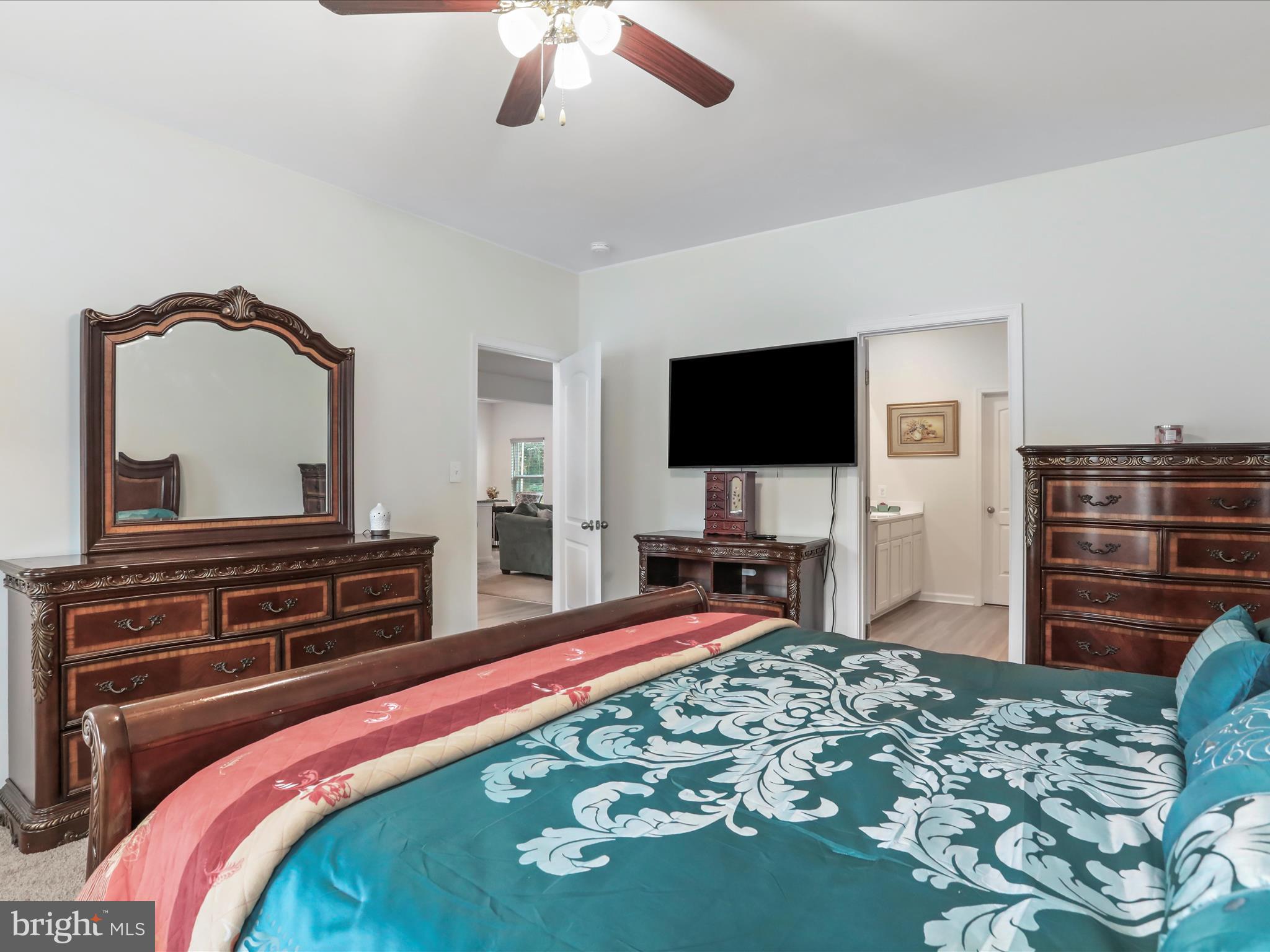 208 Rappahannock Run Falling Waters, WV 25419 - Photo 14 of 44 a bedroom with a bed and a flat screen tv