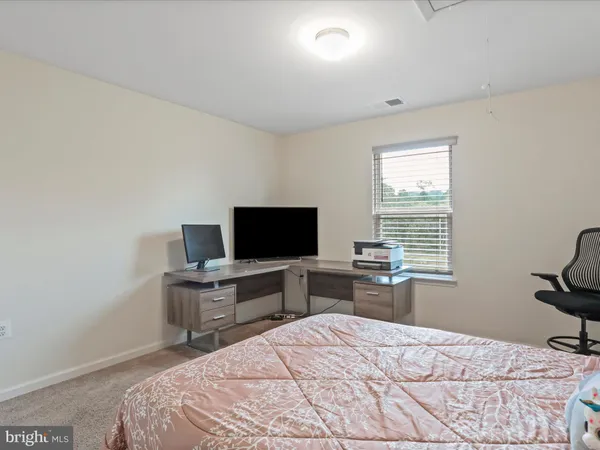 a bedroom with a bed and a closet