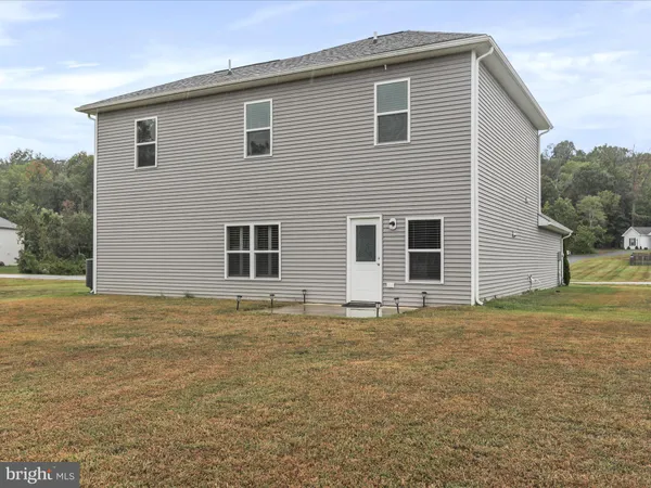 a house view with a backyard space