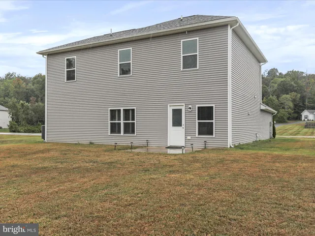 a house view with a backyard space