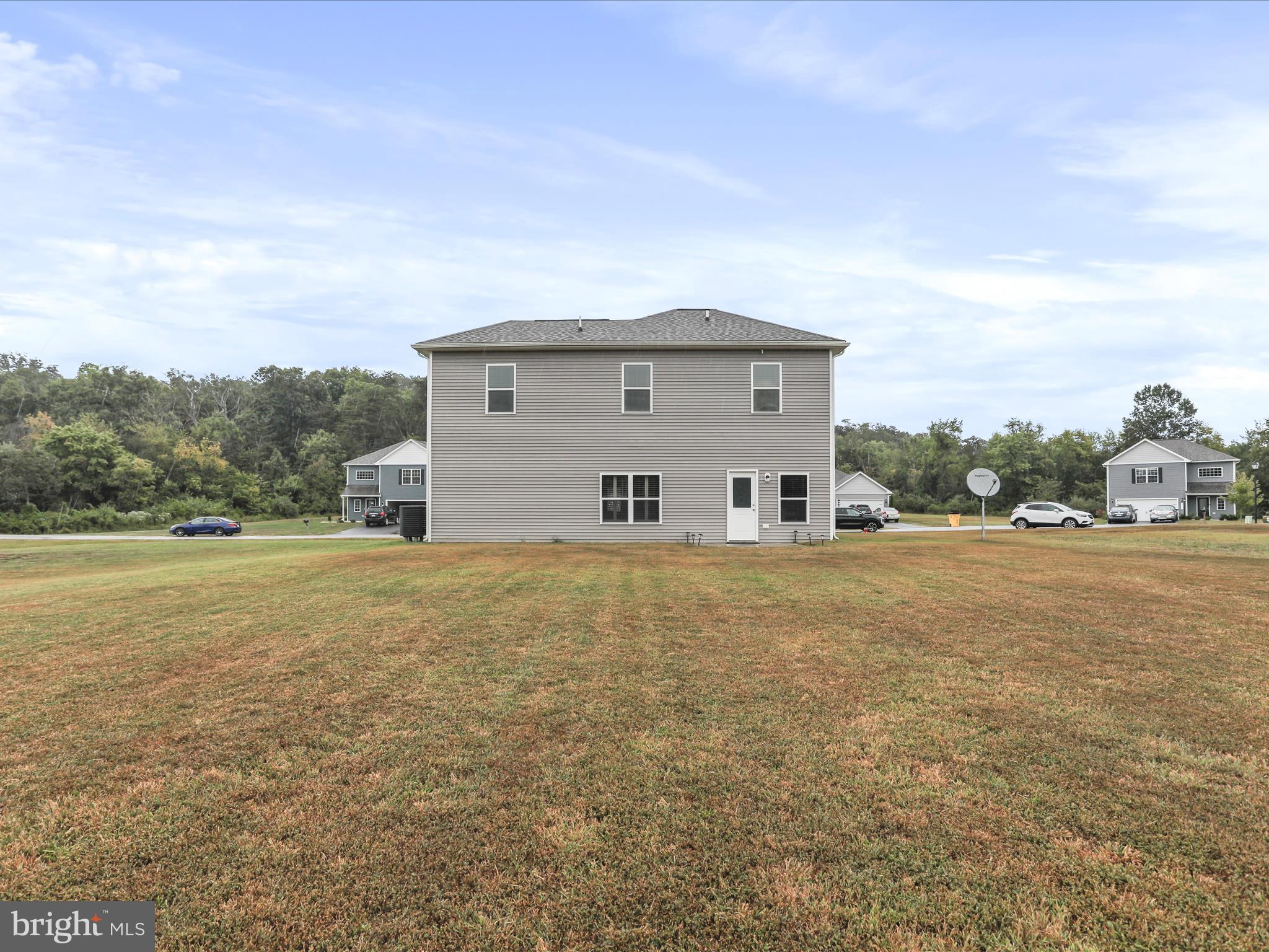 208 Rappahannock Run Falling Waters, WV 25419 - Photo 31 of 44 a view of a house with a yard