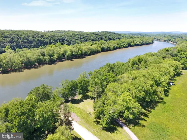 a view of a lake with a yard