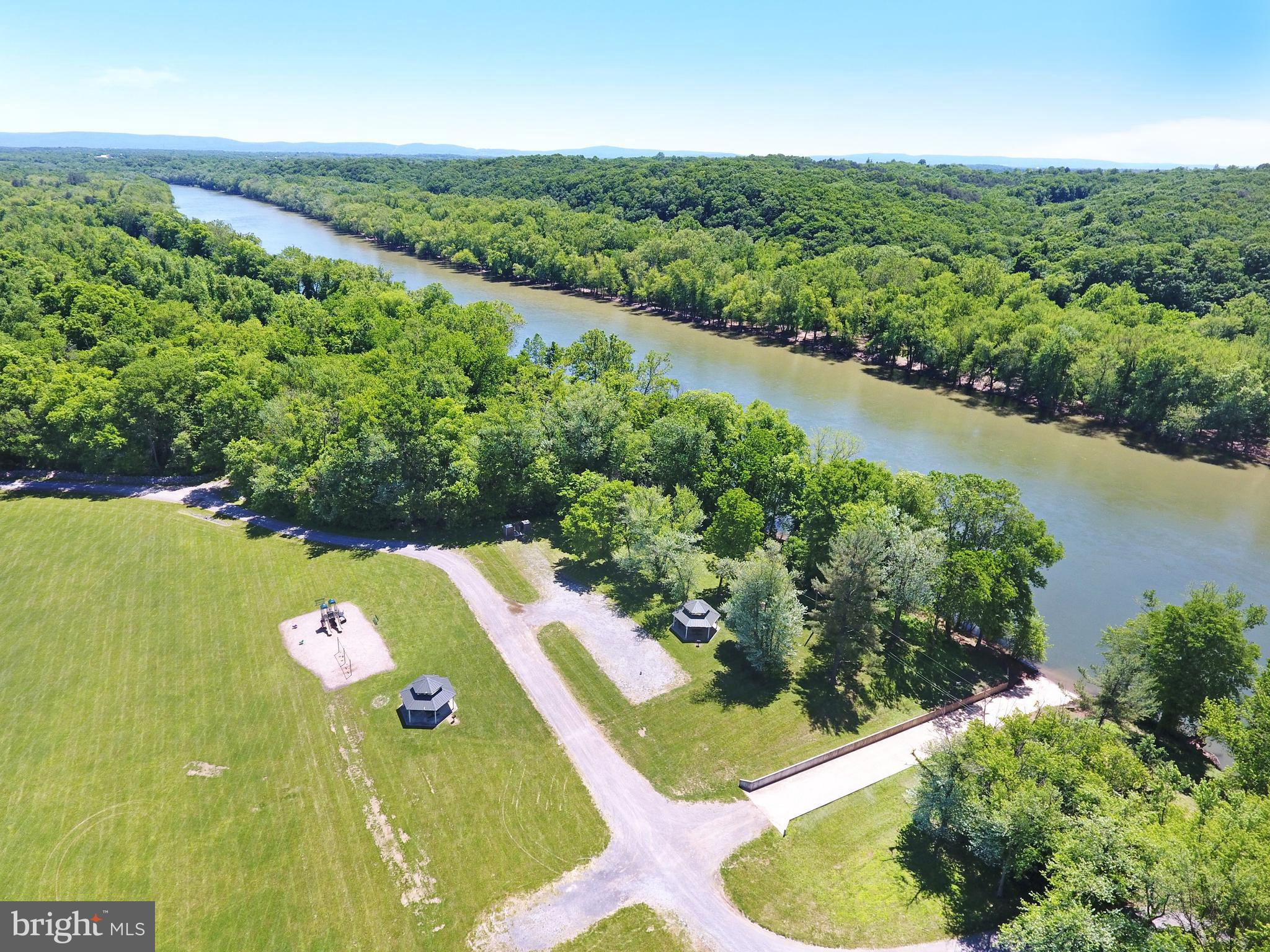 208 Rappahannock Run Falling Waters, WV 25419 - Photo 40 of 44 a view of a garden with a lake