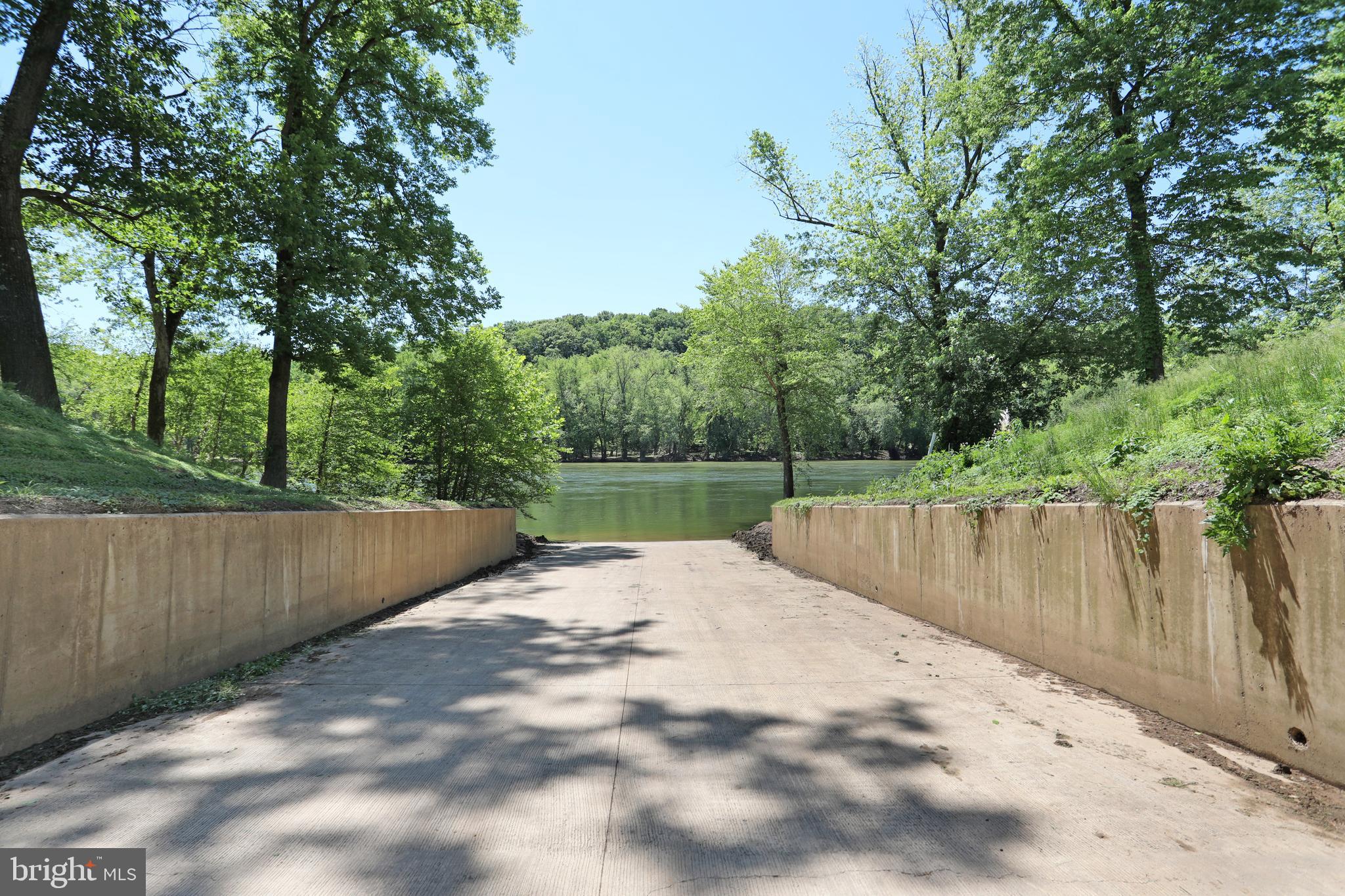 208 Rappahannock Run Falling Waters, WV 25419 - Photo 43 of 44 a view of wooden fence and trees in the background