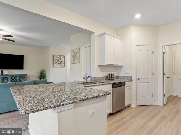 a kitchen with stainless steel appliances granite countertop a stove and a sink