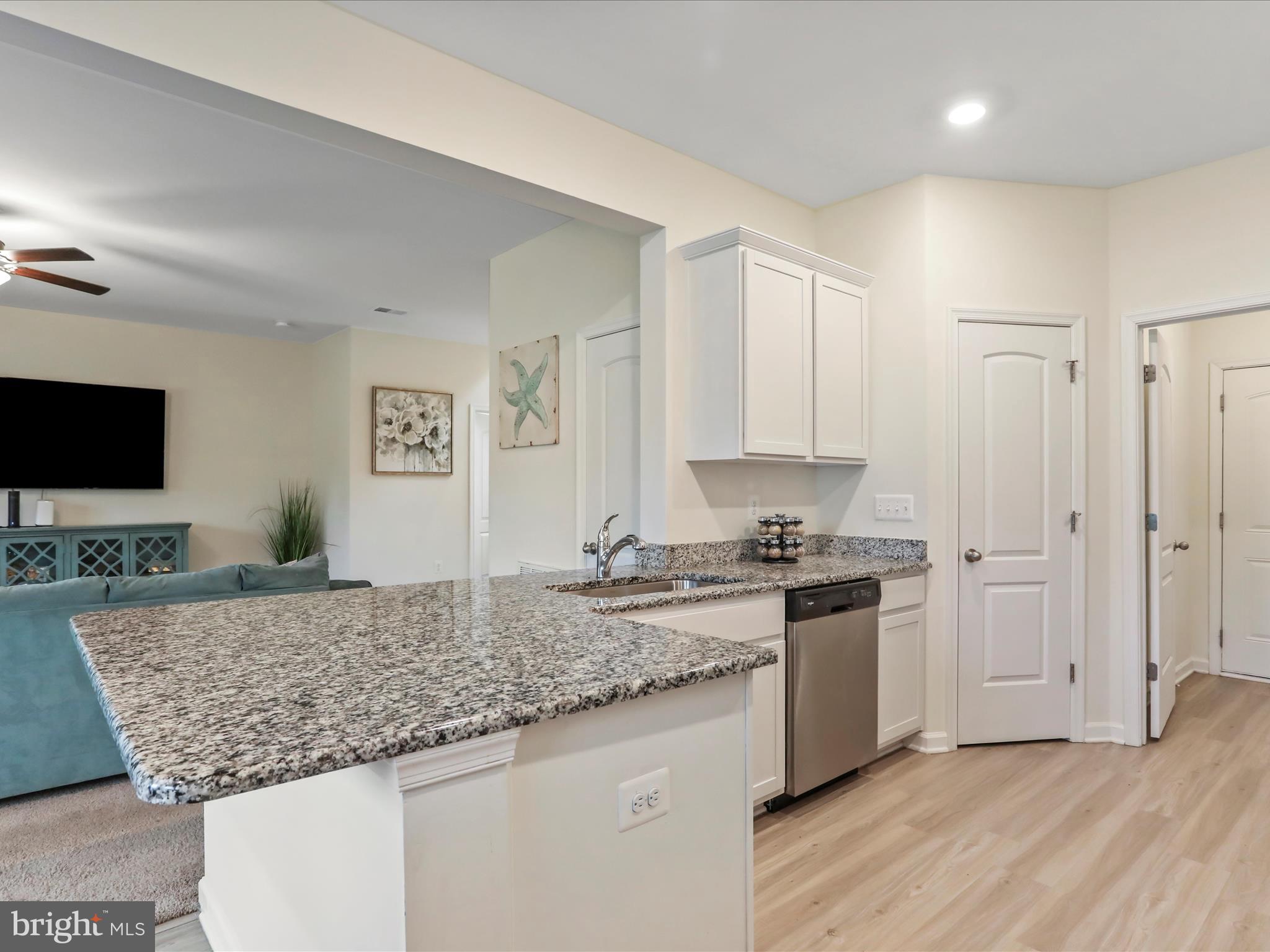 208 Rappahannock Run Falling Waters, WV 25419 - Photo 5 of 44 a kitchen with stainless steel appliances granite countertop a stove and a sink