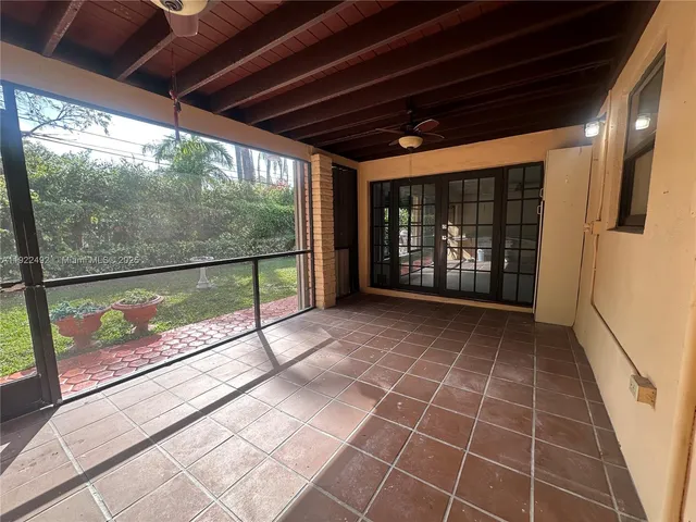 a view of a porch with wooden floor