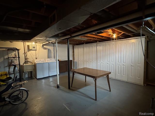31056 Richert Street, Unit 8 Fraser, MI 48026 - Photo 17 of 19 Unfinished basement with separate washer and dryer and a sink