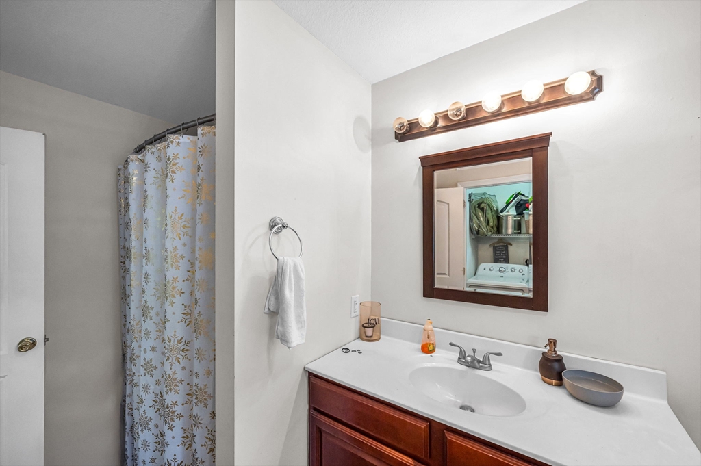 31 Acrebrook Road Springfield, MA 01129 - Photo 23 of 42 a bathroom with a sink vanity and a mirror