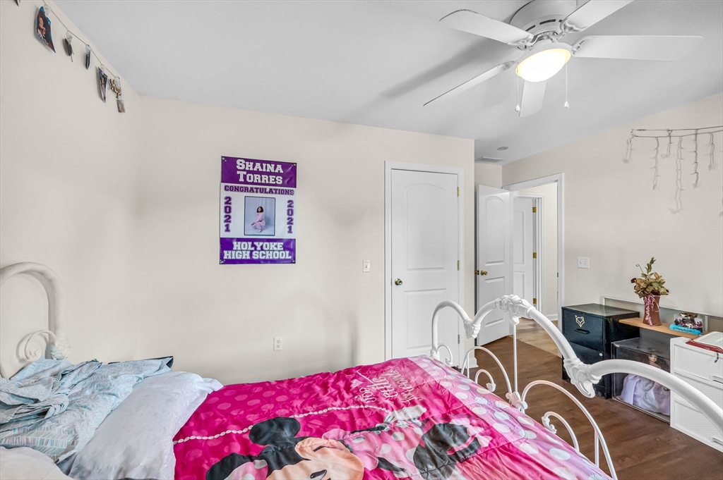 31 Acrebrook Road Springfield, MA 01129 - Photo 30 of 42 a bedroom with a bed and a chandelier