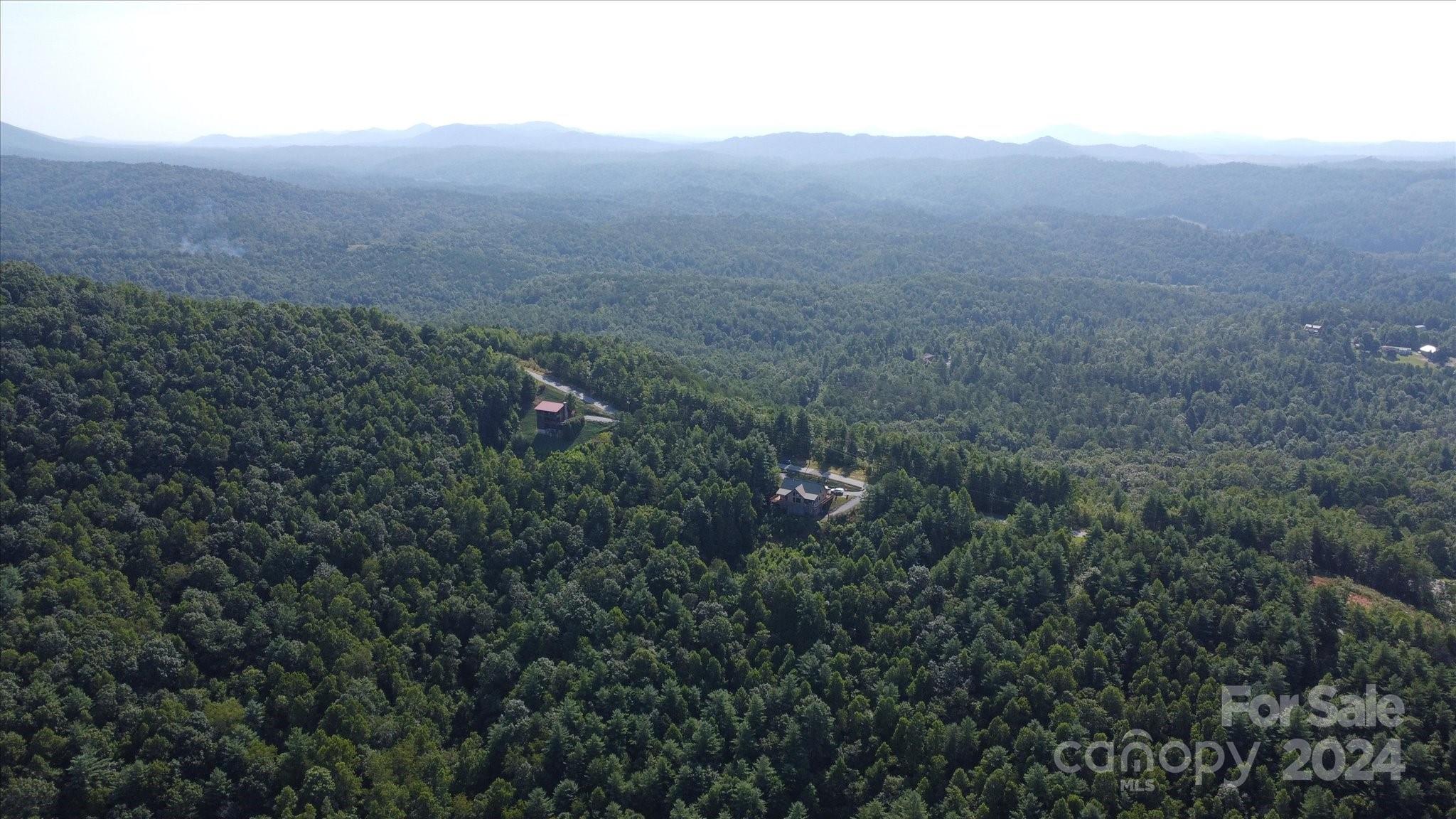 0 Tomahawk Ridge Drive Lenoir, NC 28645 - Photo 5 of 13 a view of a field of grass and trees