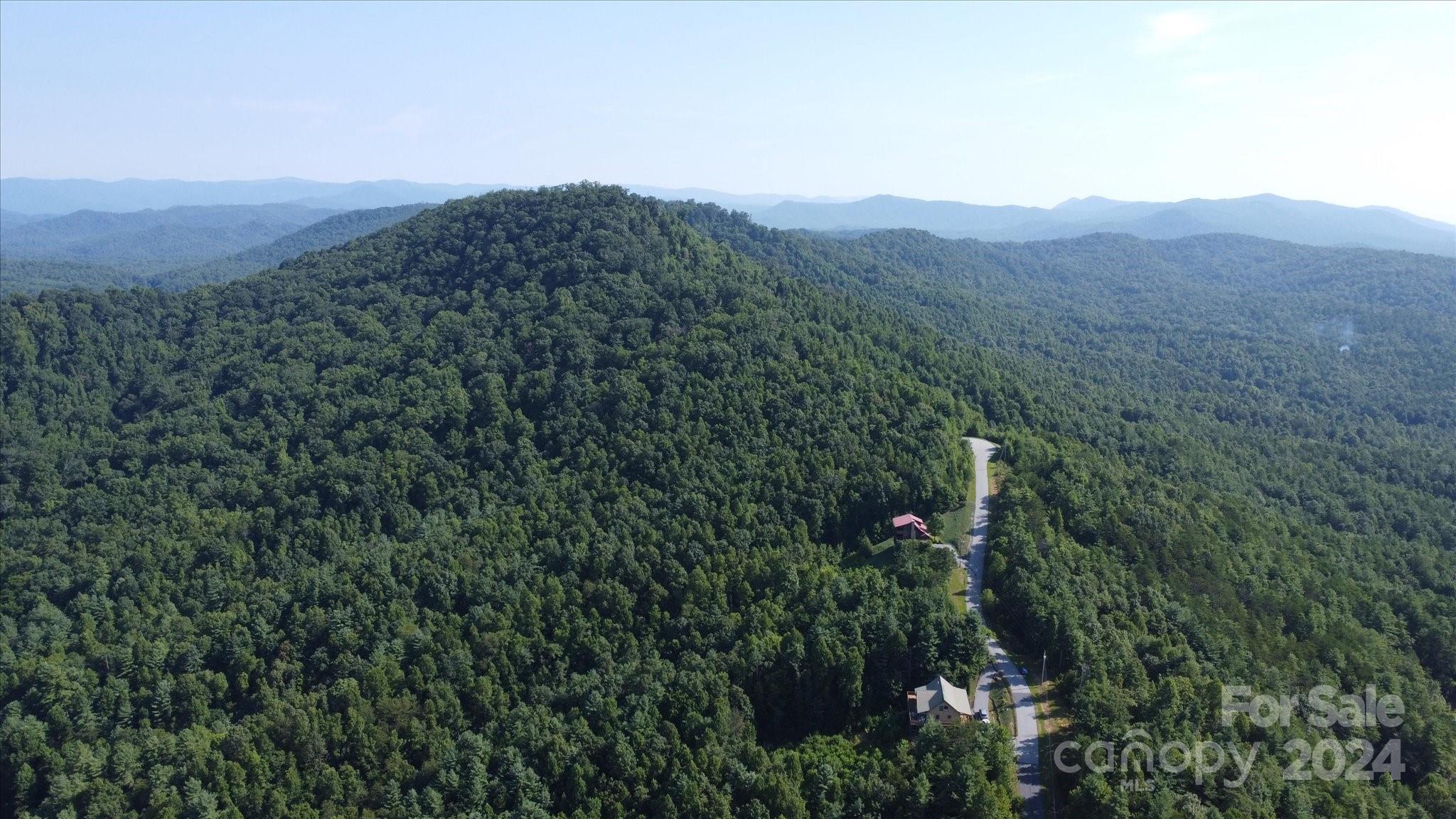 0 Tomahawk Ridge Drive Lenoir, NC 28645 - Photo 6 of 13 a view of a mountain range with lush green forest
