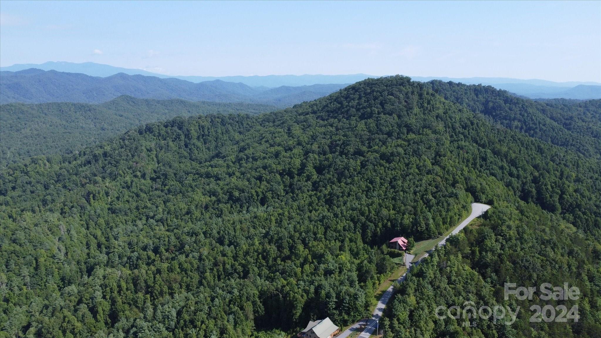 0 Tomahawk Ridge Drive Lenoir, NC 28645 - Photo 7 of 13 a view of a mountain range with lush green forest