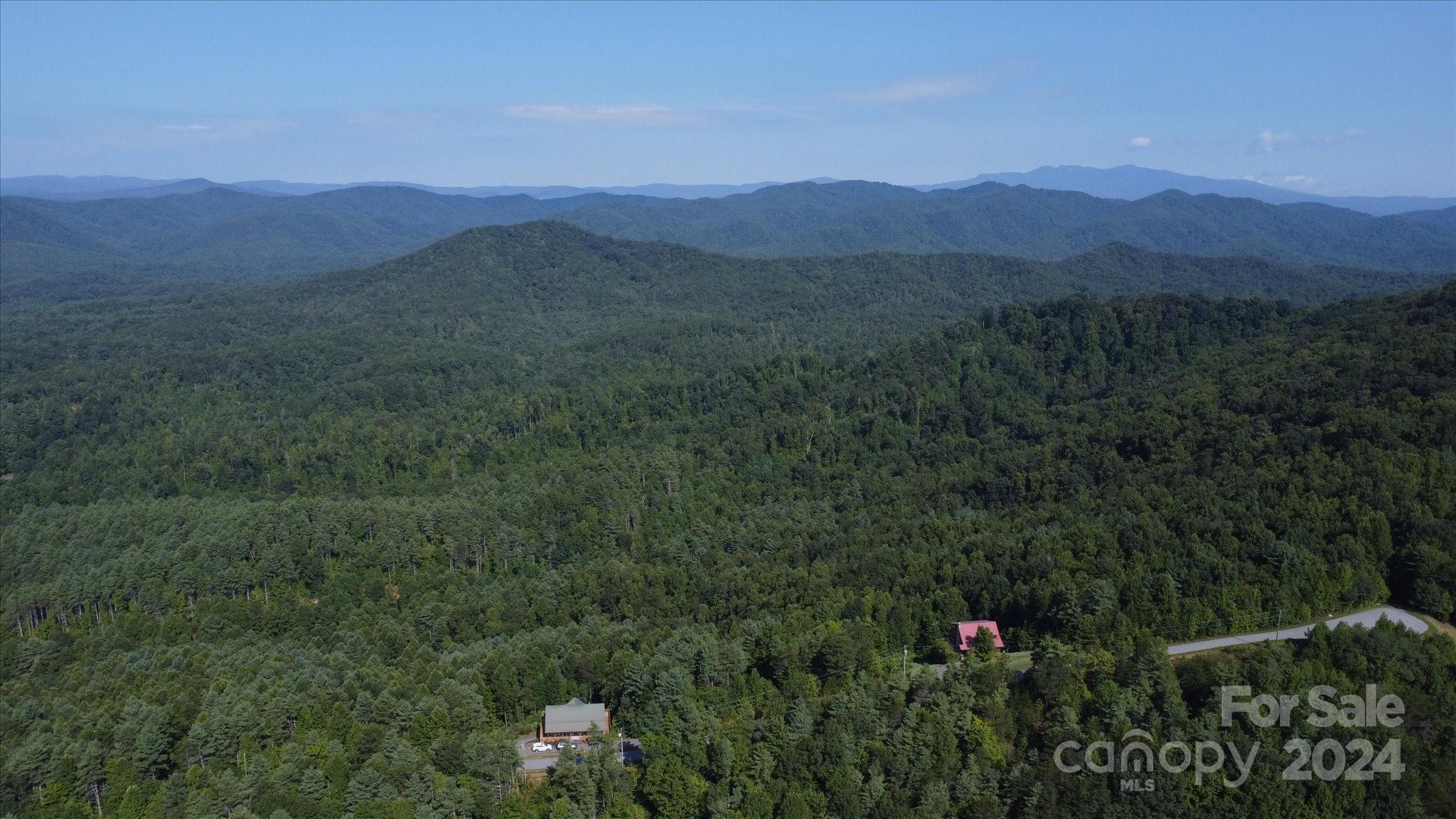 0 Tomahawk Ridge Drive Lenoir, NC 28645 - Photo 8 of 13 a view of a town with mountains in the background