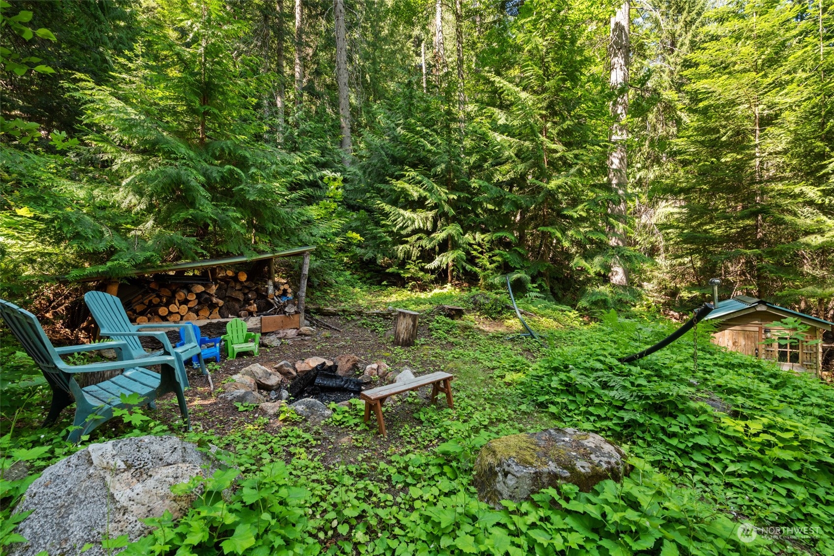 15869 Cedar Brae Road Leavenworth, WA 98826 - Photo 15 of 19 a view of a chairs in a backyard