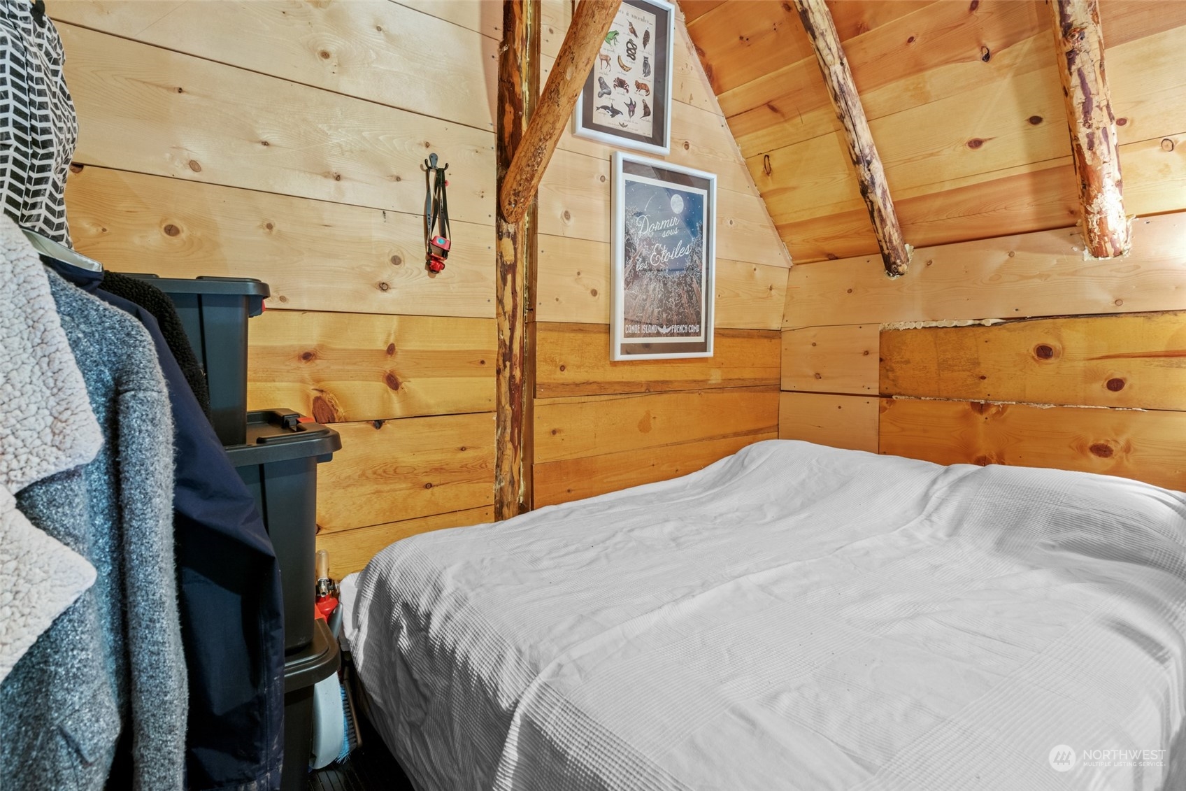 15869 Cedar Brae Road Leavenworth, WA 98826 - Photo 10 of 19 a bedroom with a bed and wooden floor