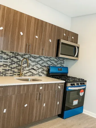 a kitchen with a stove and a microwave