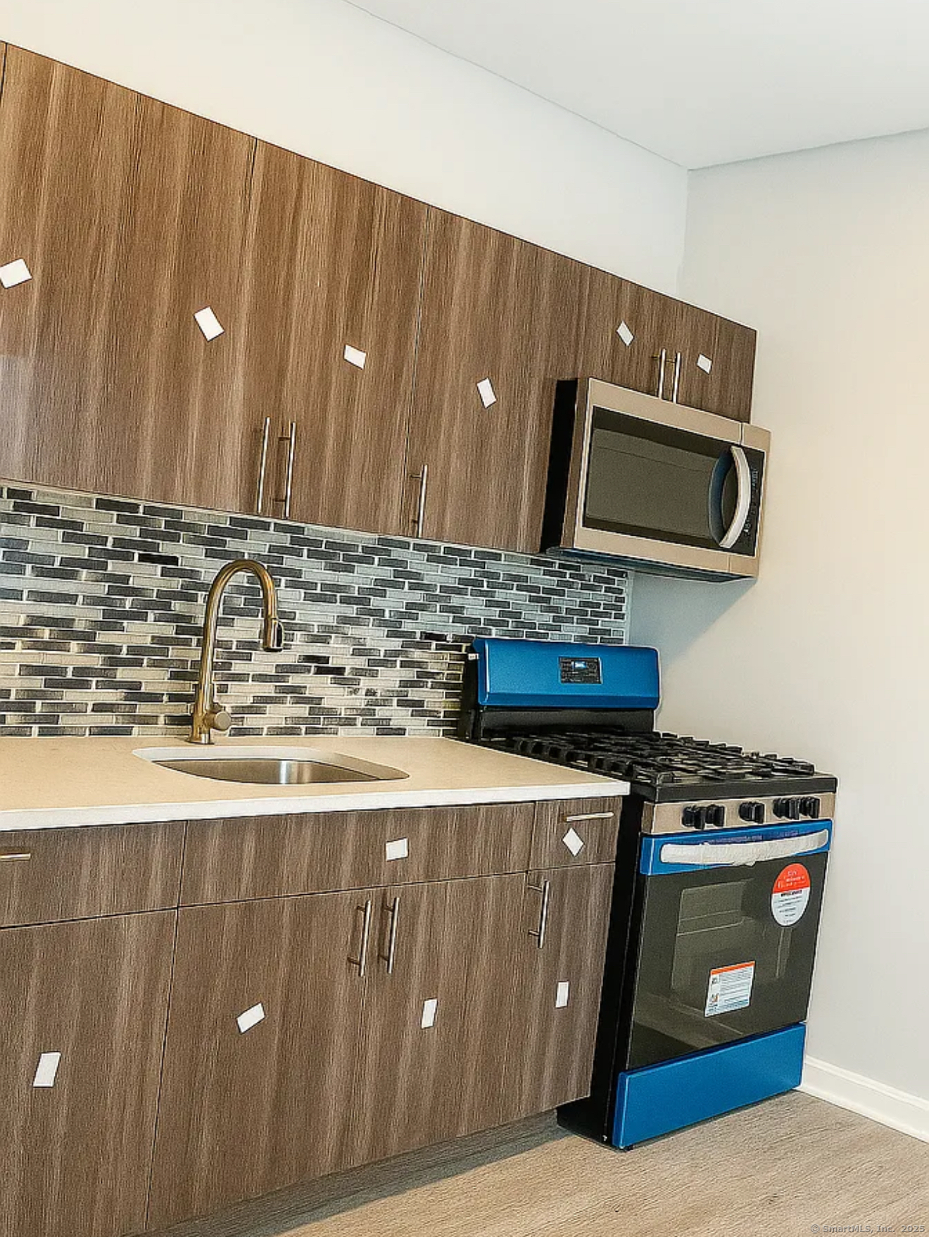 a kitchen with a stove and a microwave