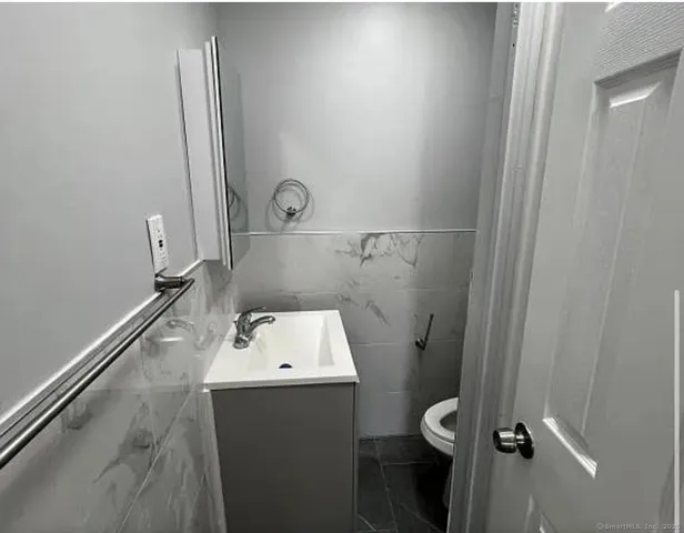 a bathroom with a toilet and a sink