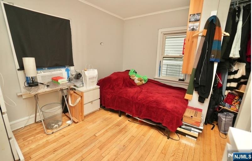 13 Thomas Street Bloomfield, NJ 07003 - Photo 13 of 18 a living room with furniture and a flat screen tv