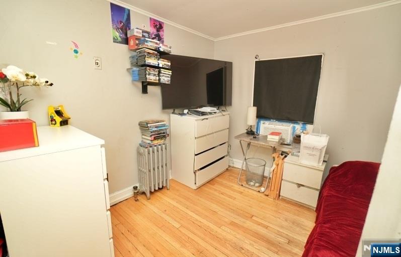 13 Thomas Street Bloomfield, NJ 07003 - Photo 14 of 18 a bedroom with a bed and a television