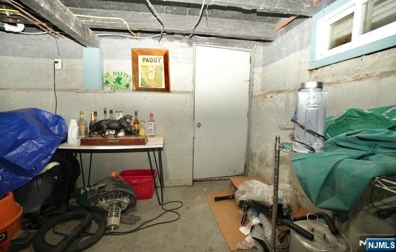 13 Thomas Street Bloomfield, NJ 07003 - Photo 15 of 18 a storage room with washer and dryer