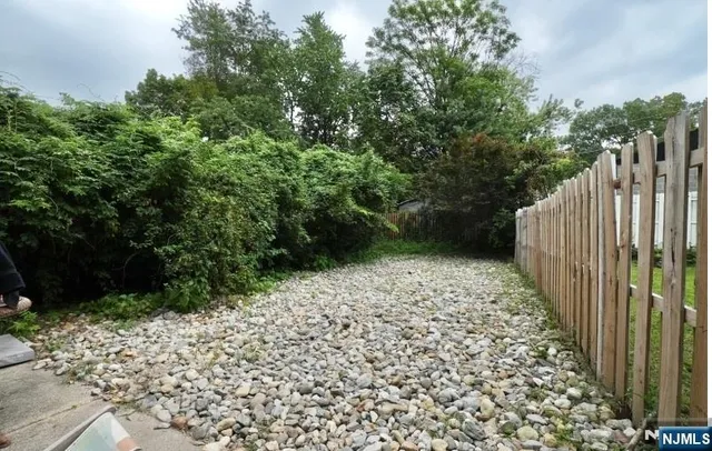 a view of balcony with wooden fence