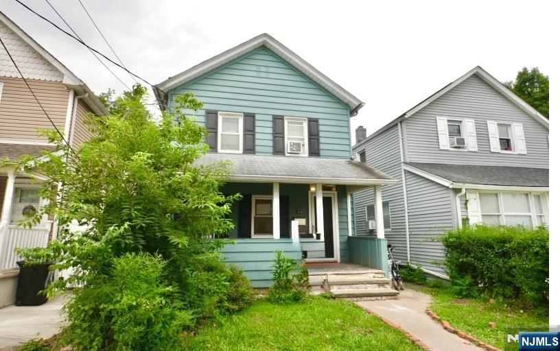 13 Thomas Street Bloomfield, NJ 07003 - Photo 18 of 18 a front view of a house with a yard