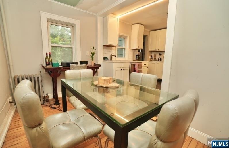 13 Thomas Street Bloomfield, NJ 07003 - Photo 5 of 18 a view of a dining room with furniture and window