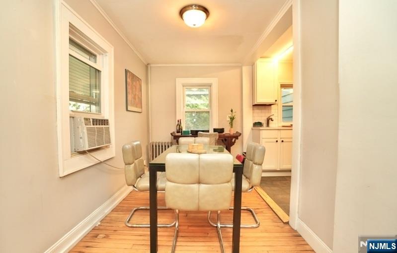 13 Thomas Street Bloomfield, NJ 07003 - Photo 6 of 18 a dining room with furniture and wooden floor