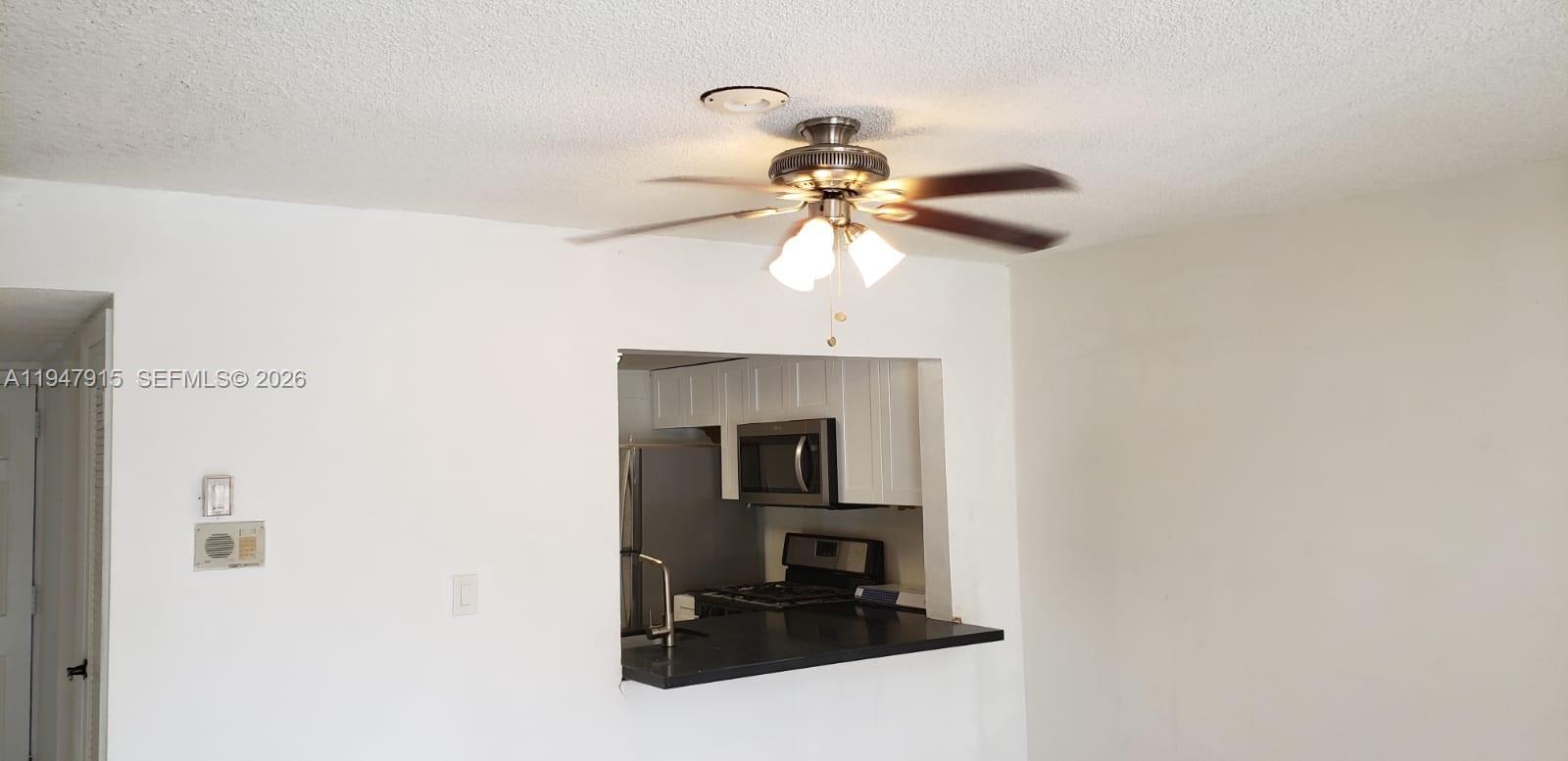 17901 Northwest 68th Avenue, Unit Q201 Hialeah, FL 33015 - Photo 4 of 6 a picture of a bathroom with a sink and a mirror