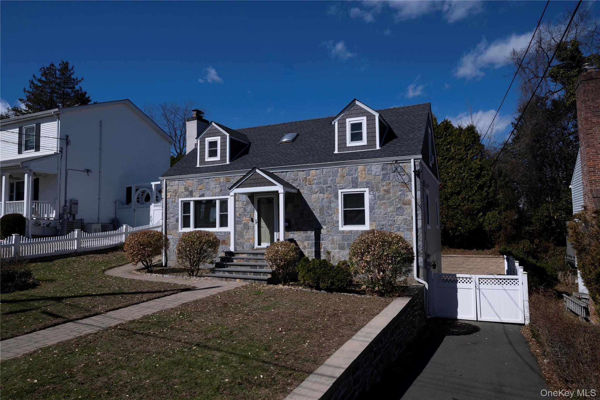 40 Wickford Road New Rochelle, NY 10801 - Photo 2 of 32 a front view of a house with a yard