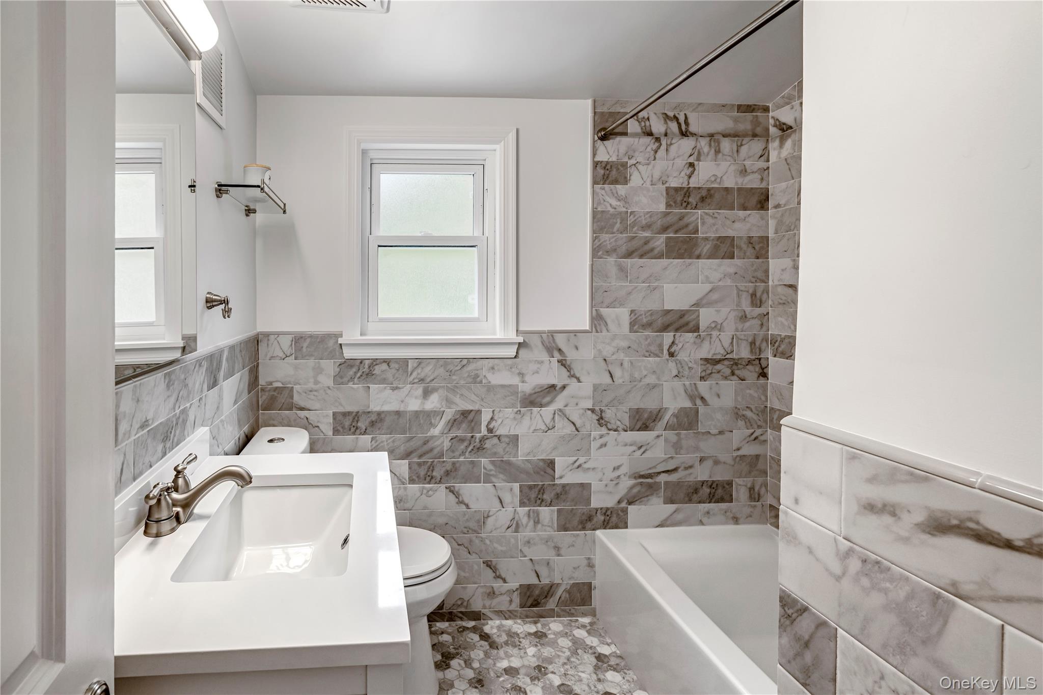 40 Wickford Road New Rochelle, NY 10801 - Photo 25 of 32 a bathroom with a sink toilet and shower