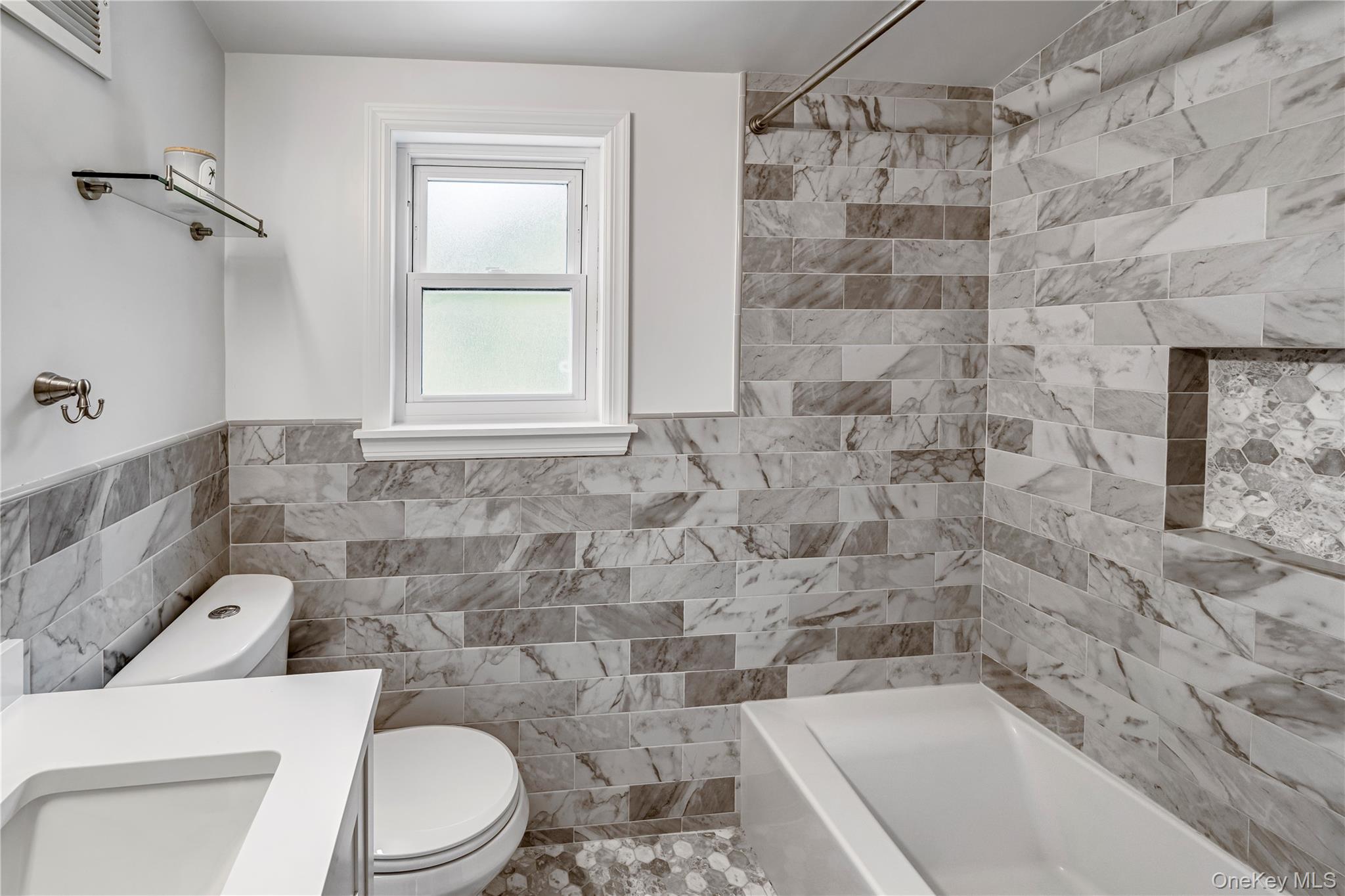 40 Wickford Road New Rochelle, NY 10801 - Photo 26 of 32 a bathroom with a toilet and a shower