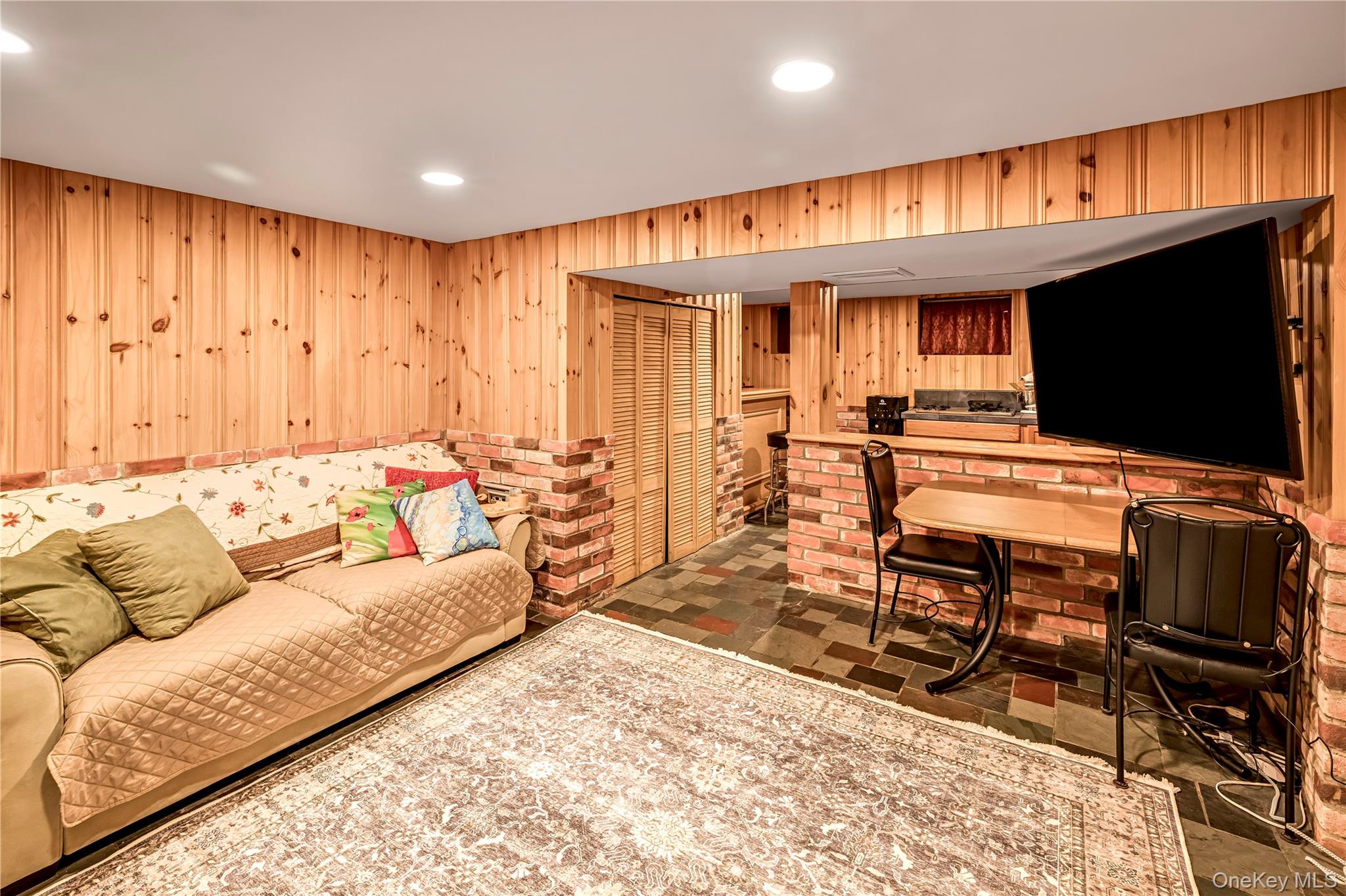 40 Wickford Road New Rochelle, NY 10801 - Photo 27 of 32 a living room with furniture and a flat screen tv