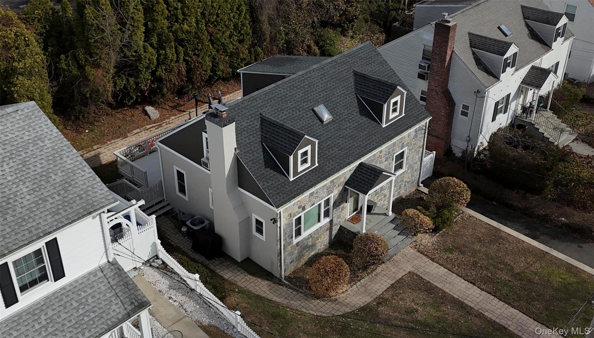 40 Wickford Road New Rochelle, NY 10801 - Photo 3 of 32 an aerial view of a house with backyard