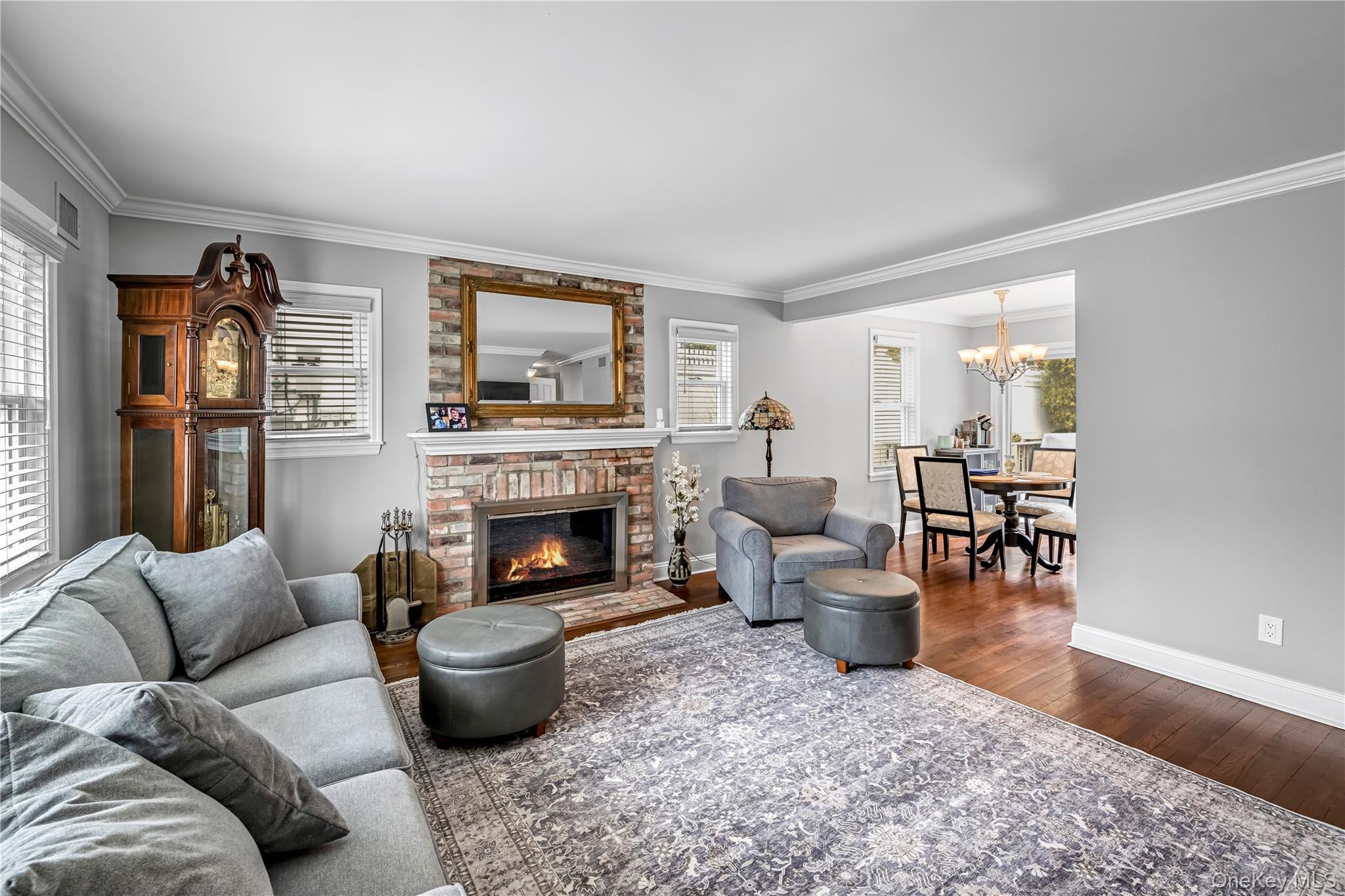 40 Wickford Road New Rochelle, NY 10801 - Photo 4 of 32 a living room with furniture and a fireplace