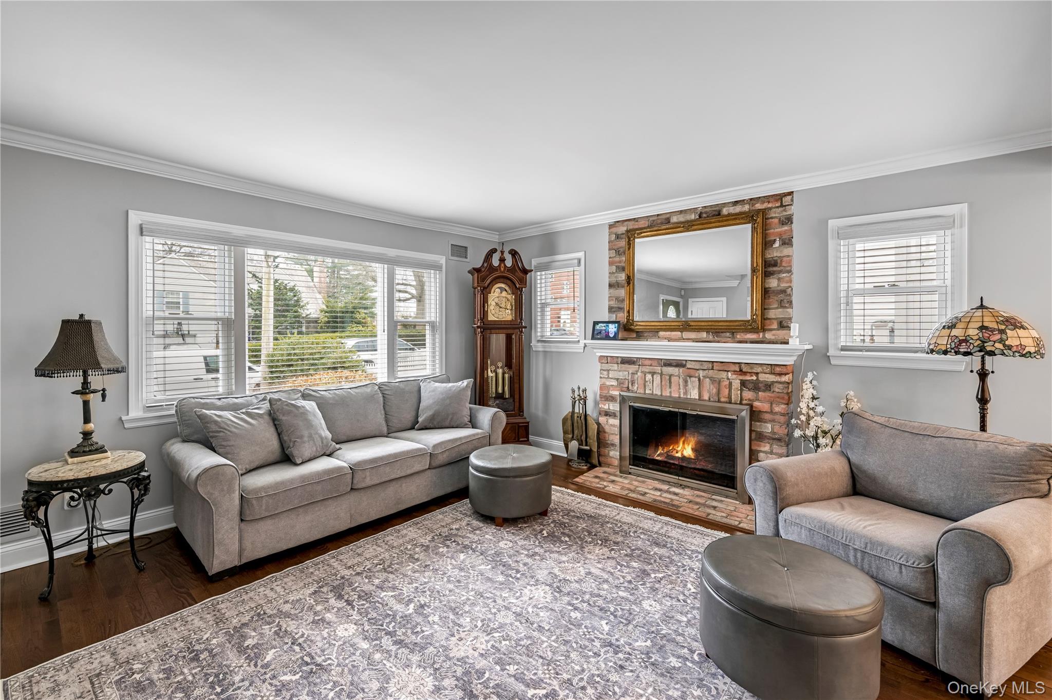 40 Wickford Road New Rochelle, NY 10801 - Photo 5 of 32 a living room with furniture a fireplace and a large window