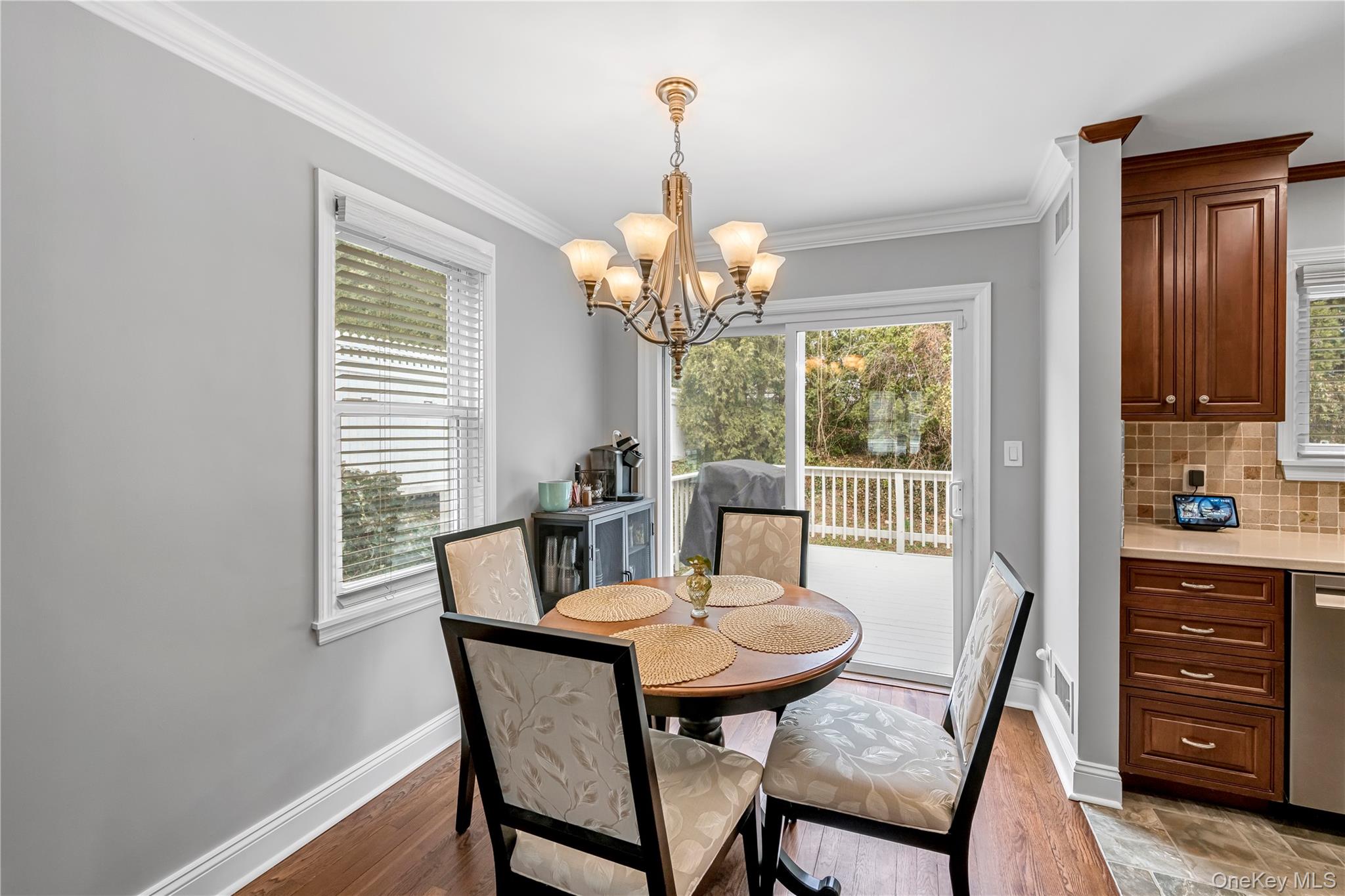 40 Wickford Road New Rochelle, NY 10801 - Photo 7 of 32 a view of a dining room with furniture wooden floor and chandelier