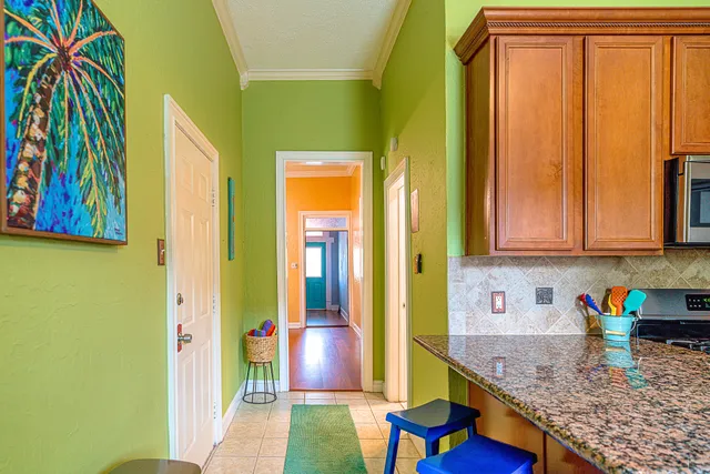 a kitchen with stainless steel appliances granite countertop cabinets and a window