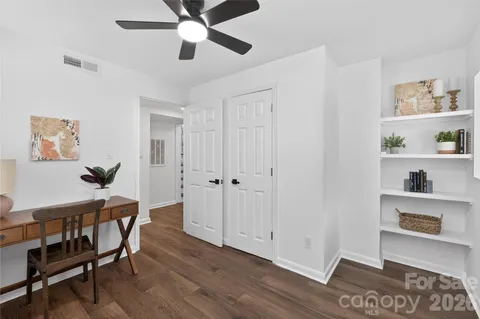 a view of a livingroom with furniture and wooden floor