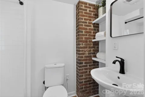 a bathroom with a toilet and a sink