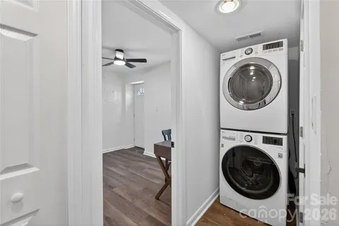 a view of a hallway with washer and dryer