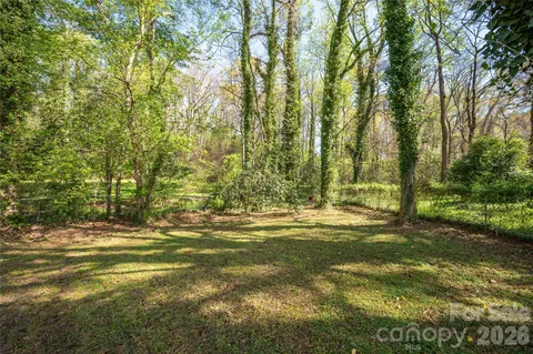 a view of a yard with an trees