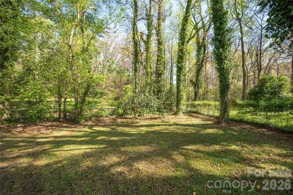 a view of a yard with an trees