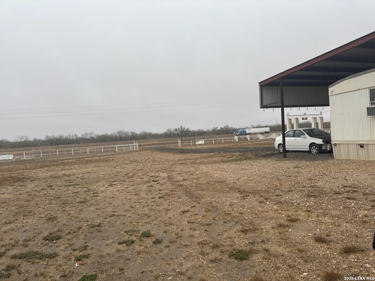 2265 Ih 35 Encinal, TX 78019 - Photo 6 of 6 a view of a lake with lawn chairs and large trees